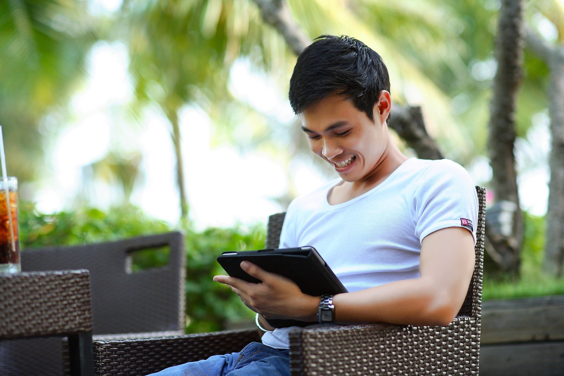 a man holding an ipad