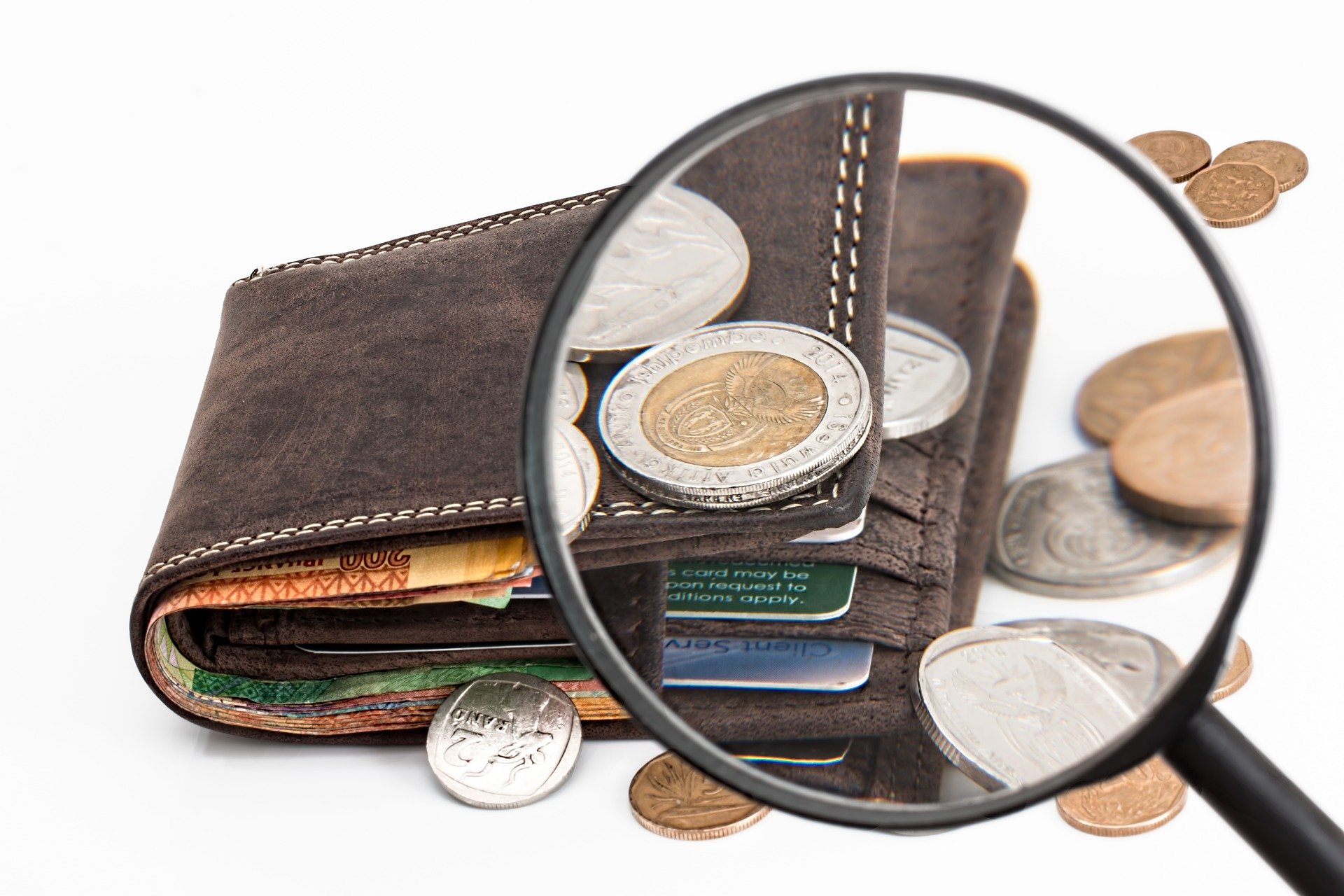 a magnifying glass and a wallet